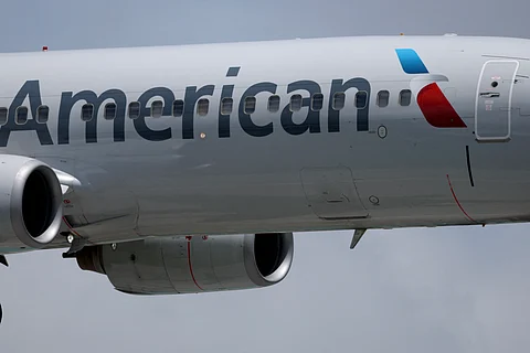 AN American Airlines plane lands at the Miami International Airport on July 24, 2025 in Miami, Florida. American Airlines issued a cautious forecast for the third quarter and narrowed its full-year guidance, due to ongoing uncertainty in travel demand.