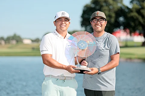 KURT Kitayama (left) shares his victory with his brother and caddie, Daniel, during the 3M Open at the TPC Twin Cities in Blaine, Minnesota.