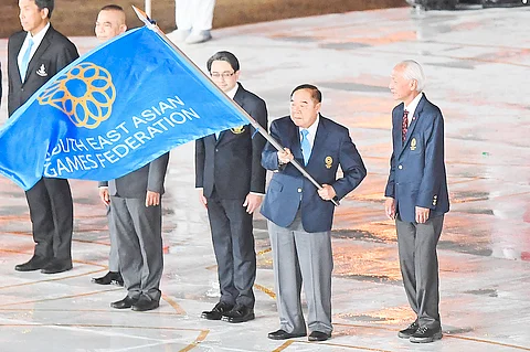 Thailand's Deputy Prime Minister Prawit Wongsuwan receives the Southeast Asian Games Federation flag during the closing ceremony of the 32nd SEA Games that Cambodia hosted in 2023. Cambodians could skip the Thais hosting of the 33rd edition of the Games due to their ongoing border wars.