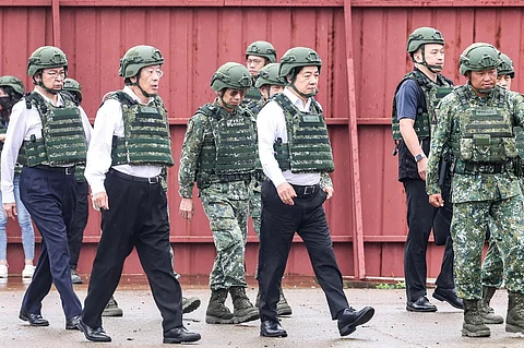 Taiwan's President Lai Ching-te (C) arrives at the Kengzikou Tank Range for a live-fire shooting session for Taiwan's first batch of the advanced US-made M1A2T Abrams tanks, which takes place separately from the annual Han Kuang military exercise, in Hsinchu on July 10, 2025. Taiwan kicked off its largest military drills on July 9 with regular troops joined by a record mobilisation of reservists for 10 days of training aimed at defending against a Chinese invasion.