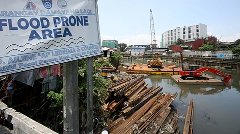 Steel sheet piles are seen at an ongoing Department of Public Works and Highways (DPWH) flood control project along the flood-prone San Juan River in Barangay Damayang Lagi, Quezon City. The construction activity comes a day after President Ferdinand Marcos Jr., in his fourth State of the Nation Address, ordered a review of all government flood control projects and a crackdown on corrupt officials linked to anomalies.