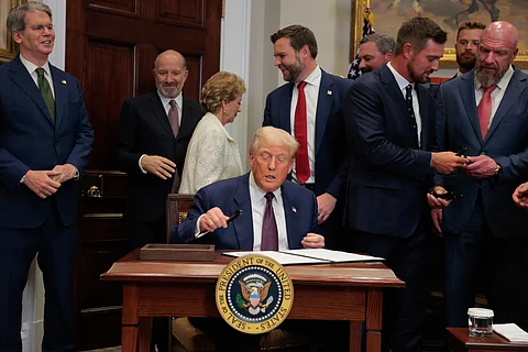 WASHINGTON, DC - JULY 31: U.S. President Donald Trump signs an executive order in the Roosevelt Room of the White House on July 31, 2025 in Washington, DC. Trump signed a series of orders that will expand on his council on sports, fitness and nutrition, including by reviving the Presidential Fitness Test in public schools.