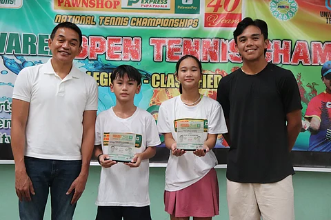 KATHLYN Bugna (second from right) holds her trophy after clinching another twin-title feat and earning MVP honors anew in the Cong. Eric Olivarez National Open Tennis Championships in Parañaque. Also shown are (from left) Cong. Eric Olivarez, fellow MVP Jan Caleb Villeno, and recent National Open men’s champion Eric Jed Olivarez.