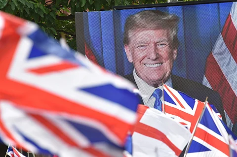 A picture of US President Donald Trump is displayed at a far-right Britain First party 'March for Remigration' calling for mass deportation, in Manchester, northwest England, on 2 August 2025.