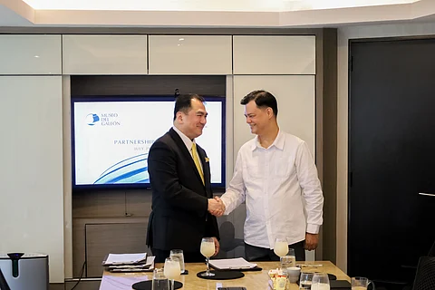 Atty. Nilo T. Divina (left), Founder and Managing Partner of DivinaLaw, with Museo del Galeón Executive Director Manuel L. Quezon III (right) during the ceremonial signing of the Memorandum of Agreement at the DivinaLaw office in Makati City.