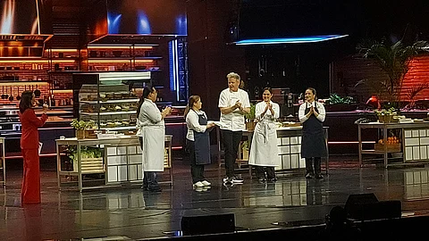 Chef Nica receiving her prize from Gordon Ramsay.