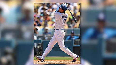 SHOHEI Ohtani of the Los Angeles Dodgers hits a two-run home run to post his 1,000th MLB career homer in the third inning of their game against the St. Louis Cardinals.