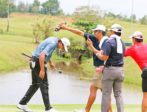 Keanu Jahns (left) gets doused by fellow golfers on the 18th green after winning the 2025 ICTSI Caliraya Springs Championship at the Arnold Palmer Lakeside Course, Caliraya Springs Golf Club, Cavinti, Laguna on Friday.