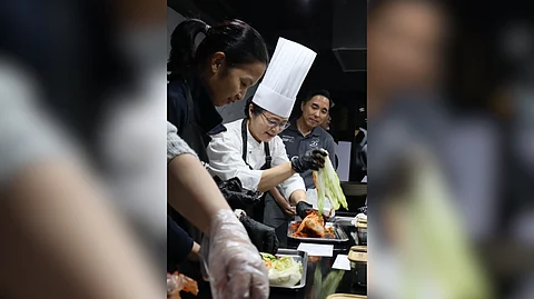 Chef Sunhee Lee delights guests with authentic Korean banchan creations.