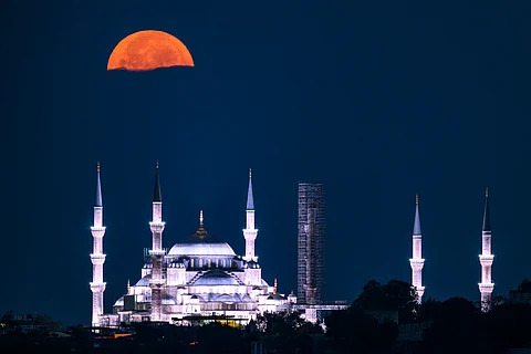 THE sturgeon supermoon rises over the Sultan Ahmed Mosque (Sultan Ahmet Mosque), also known as Blue Mosque, in Istanbul on August 9, 2025.