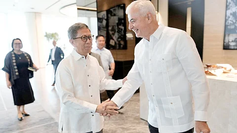 Forest for Life Environment Secretary Raphael Lotilla (left) and Ayala Corporation vice chairman Fernando Zobel de Ayala seal the planting of five millions trees by 2028.