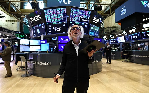 Stock trader Peter Tuchman "Einstein of Wall Street" works on the floor of the New York Stock Exchange (NYSE) at the opening bell in New York City, on August 11, 2025. Wall Street stocks opened mixed Monday, ahead of a key US inflation report and as the clock ticked down to a deadline for higher tit-for-tat tariffs to return between Washington and Beijing.