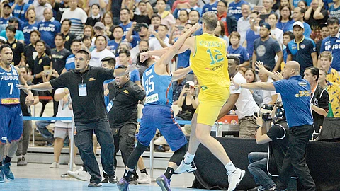 DANIEL Kickert (right) punches the smaller Matthew Wright in a free-for-all brawl between Gilas Pilipinas and Australia in the FIBA World Cup Qualifiers in 2018.
