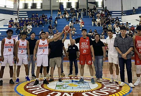 GLENN Escandor (middle) presides over the ceremonial jump ball during the opening of the 2025 Escandor Cup on Saturday at the Davao City Recreation Center.