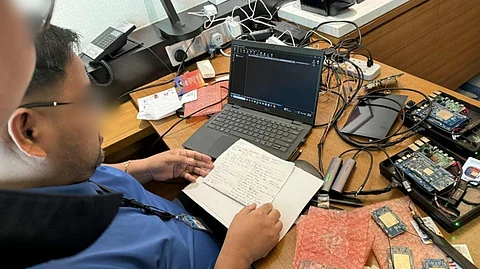 AN officer from the National Bureau of Investigation–Central Visayas Regional Office checks on the evidence gained from an anti-cybercrime operation against the alleged distribution and use of illicit transceivers by foreign nationals in Cebu City. The operation was in coordination with the Cybercrime Investigation and Coordination Center and Bureau of Immigration.