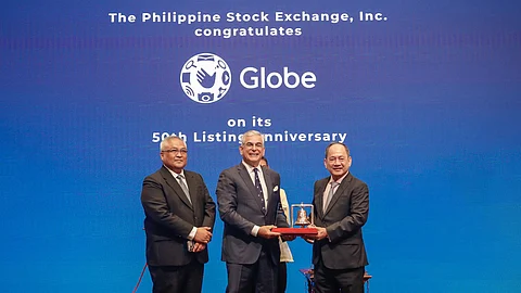 Philippine Stock Exchange president and CEO Ramon S. Monzon (right) presents the listing anniversary plaque to GLO Chairman Jaime Augusto Zobel de Ayala (center) and GLO president and CEO Carl Raymond R. Cruz. Globe commemorated its 50th year as a publicly-listed company on Monday, 11 August 2025.