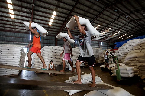 Workers from the National Food Authority load sacks of rice set to be delivered to the various Kadiwa ng Pangulo stores in Bulacan on Wednesday which is part of the Department of Agriculture’s ‘P20 Benteng Bigas Meron Na Para sa Magsasaka’ program.