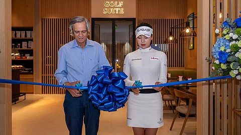 INA Yoon (right) joins Bloomberry Resorts Corp. chairman and CEO Enrique K. Razon Jr. in cutting the ceremonial ribbon to officially unveil the Golf Suite — a state-of-the-art virtual golf facility — at the newly opened Solaire Sports Club in Entertainment City, Parañaque.