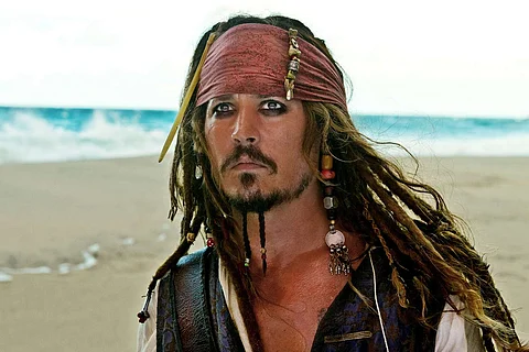 Johnny Depp as Captain Jack Sparrow.