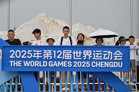 Spectators watch the award ceremony for the men's individual duathlon final during the 2025 World Games at the Xinglong Lake Hubin Arena in Chengdu, in China's southwestern Sichuan province on August 14, 2025.