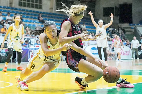 STEPHANIE Berberabe (left) muscles her way to a triple-double performance to lead the Tagaytay-Tol to a 91-63 win over RK Hoops-Quezon City in the 2025 WMPBL regular season late Sunday at the Olivarez Gym in Tagaytay City.