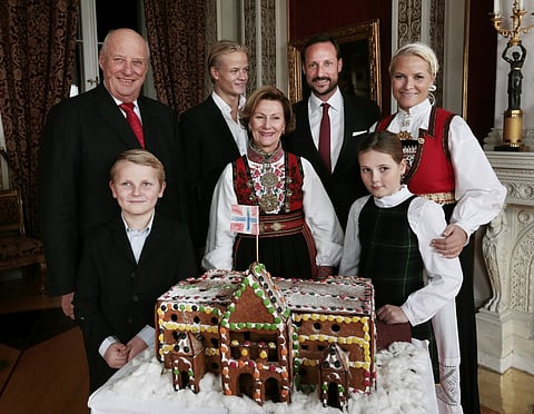 Back row (L-R) King Harald, Crown Prince Marius Borg Hoiby, Crown Prince Haakon and Crown Princess Mette-Marit, front (L-R) Prince Sverre Magnus, Queen Sonja and Princess Ingrid Alexandra pose during a Christmas photo session at the Royal Palace in Oslo, on December 17, 2014.