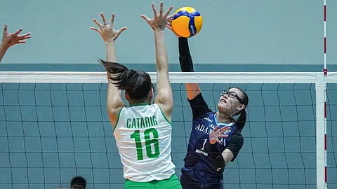 SHAINA Nitura of Adamson attacks the defense of Clydel Catarig of Saint Benilde during their 2025 V-League Collegiate Challenge duel on Tuesday. The Lady Falcons prevailed, 25-22, 25-13, 25-20.