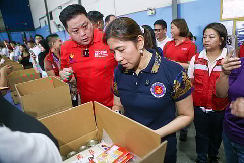 Social Welfare and Development Secretary Rex Gatchalian, joined by Budget and Management Secretary Amenah Pangandaman, inspects the DSWD Family Food Pack warehouse in Parañaque City on the morning of August 19, 2025. The facility serves as a key staging area for the distribution of relief goods to communities in need.