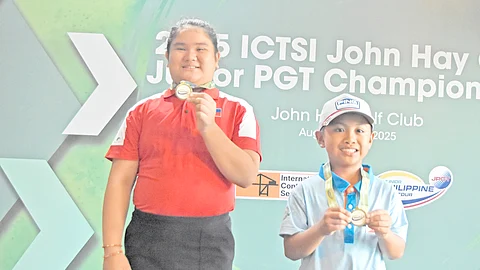 RONEE Dungca (left) and Zoji Edoc show off their medals after topping their respective divisions in the rain-hit JPGT John Hay Championship in Baguio City on Wednesday.