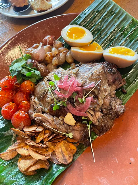Chef Robby Goco flexes lamb chops