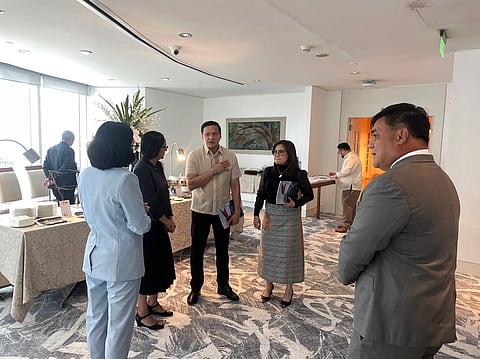 Supreme Court Associate Justice Jose Midas Marquez (center) speaks with officials of the International Centre for Missing & Exploited. Children at the launch of A Compendium of Perspectives: Bridging the gap between Judicial and Law Enforcement Understanding of the Personal Knowledge Requirement in OSAEC/CSAEM on 14 August 2025, at the Rizal Commercial Banking Corporation Plaza, Makati City. (Photo Courtesy of the International Centre for Missing &Exploited Children)