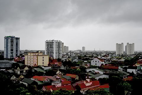 STORM clouds form above the buildings in Vinh city, Nghe An province on 25 August 2025, before ‘Typhoon Kajiki’ makes landfall in Vietnam.