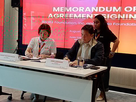 Aboitiz Foundation president Ginggay Hontiveros-Malvar and Okada Foundation president James Lorenzana sign the memorandum of understanding at the Aboitiz Foundation's office in Makati City at 1 p.m. today, Tuesday, 26 August 2025.