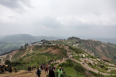 MINERS walk towards the mining pits in Rubaya, DRCONGO. Ravaged by conflict for 30 years, eastern DRC is believed to hold between 60 percent and 80 percent of the world’s reserves of coltan, an essential mineral for manufacturing electronic equipment.