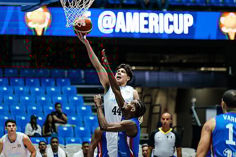 #44 Alex Negrete of Argentina drives into the basket, #1 Juan Suero of Dominican Republic trying to intercept.