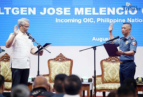 DILG Secretary Jonvic Remulla administers the oath of PLt. Gen. Jose Melencio Nartatez Jr. as officer-in-charge of the Philippine National Police during the assumption of command ceremony at Camp Crame, Quezon City, on Tuesday. Nartatez replaced PNP Chief Gen. Nicolas Torre III.