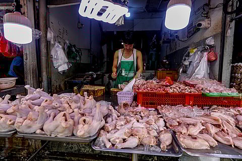 Fresh chicken and poultry products are being sold at a wet market stall in Quezon City.