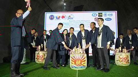 Officials from the Department of Public Works and Highways (DPWH) and the Japan International Cooperation Agency (JICA) mark the ceremonial connection of the southbound tunnel of the 45.5-kilometer Davao City Bypass on Friday, Aug. 29, 2025, in Brgy. Waan, Davao City. The 2.3-kilometer tunnel, the first long-distance mountain road tunnel in the country, is expected to cut travel time between Toril and Panabo to under an hour.