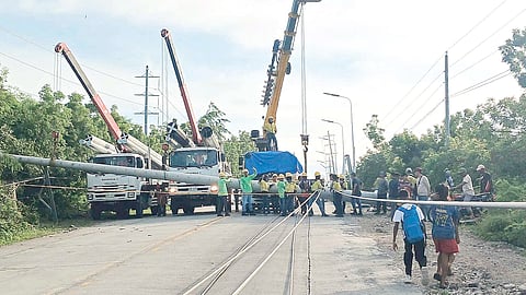A speeding truck crashed into an electric post along the national highway in Barangay Tinoto at around 2 a.m. on Friday, causing multiple poles to fall, blocking the road, and resulting in a full highway closure.