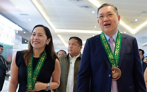 Total electrification Department of Energy Secretary Sharon Garin (left) and Administrator Antonio Mariano Almeda at the opening of the 56th founding anniversary of the National Electrification Administration and 16th National Electrification Awareness Month at SMX Convention Center in Bacolod City on 7 August. Garin challenged electric cooperatives to achieve total electrification by 2028.