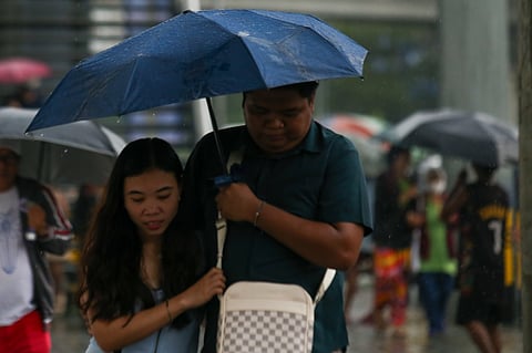 The past week has been marred by heavy rains which flooded the streets of Quezon City, leaving commuters stranded with their umbrellas as they brave the floodwaters.