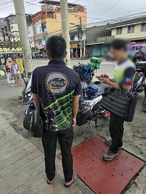 The agency reiterated its warning to the public of unauthorized wearing of PDEA uniforms or similar garments bearing the agency's official logo, or falsely claiming to be a PDEA agent without valid authority. This after a man wearing a PDEA shirt without authority was apprehended in the morning of September 3,2025 at La Trinidad, Benguet. | Aldwin Quitasol. Photo Courtesy of PDEA Cordillera