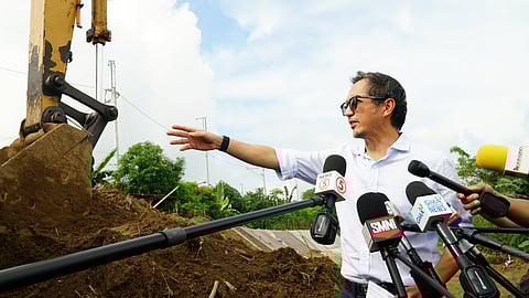 PUBLIC Works Secretary Vince Dizon surveys a freshly painted illusion in Barangay Sipat, Plaridel, Bulacan — a flood control project hurriedly dressed up in concrete and dust by Wawao Builders, three weeks in the making, to disguise what may yet be nothing more than a ghost undertaking.