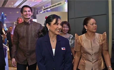 Trade Secretary Cristina Roque (2nd from left), Negros Occidental 3rd District Representative Javi Benitez (leftmost), and other DTI officials visits the booth during the Malikhaing Pinoy Creative Expo in SMX Aura on Thursday.