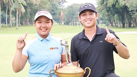 PERRY Josef Bucay and Lisa Sarines flash the No. 1 signs after winning the Philippine Amateur Open Championship in Davao City.