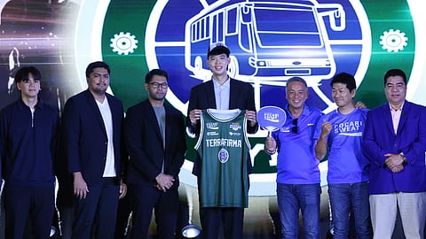 GEO Chiu (middle) smiles after emerging as top overall pick of Terrafirma in the PBA Annual Rookie Draft yesterday at the SM Mall of Asia Music Hall.