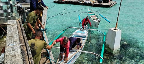 Officers from the Marine Battalion Landing Team rescue the three fishermen who have been stranded near the West Philippine Sea for nearly two days. They were provided assistance and food following their ordeal.