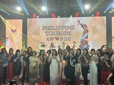 DOT Secretary Cristina Frasco poses with the awardees of the 1st Philippine Tourism Awards on Monday at the Okada Manila, Paranaque City.