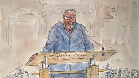 This court sketch made on September 8, 2025, shows defendant French former anaesthetist Frederic Pechier (C) standing in the courtroom on the opening day of his trial, at Besancon's courthouse, in Besancon, north eastern France. Frederic Pechier, 53, goes on trial on September 8, 2025, accused of intentionally poisoning 30 patients, 12 of whom died, in an alleged attempt to show off his resuscitation skills and discredit co-workers.