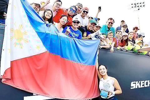 A small group of Filipinos cheers for Alex Eala after winning her first professional title in Mexico over the weekend.